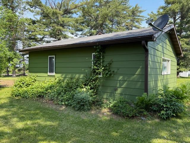 39698 10th Ave, Isle, MN 56342 - view of home's exterior featuring a lawn