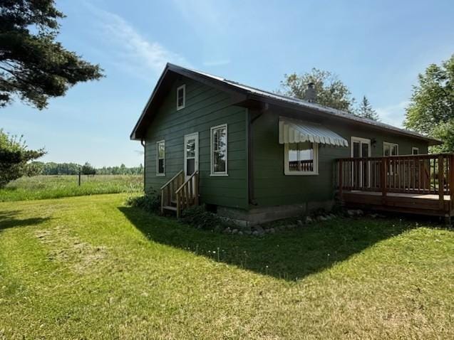 39698 10th Ave, Isle, MN 56342 - view of property exterior with a wooden deck and a yard