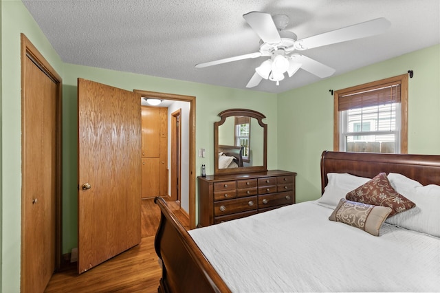 3021 Atwater St, Hopkins, MN 55305 - bedroom with multiple windows, wood finished floors, a closet, and ceiling fan