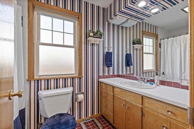 3021 Atwater St, Hopkins, MN 55305 - bathroom featuring wallpapered walls, toilet, vanity, and tile patterned flooring