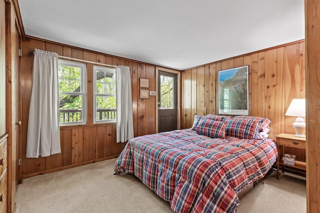 3021 Atwater St, Hopkins, MN 55305 - carpeted bedroom featuring wood walls, multiple windows, and baseboards