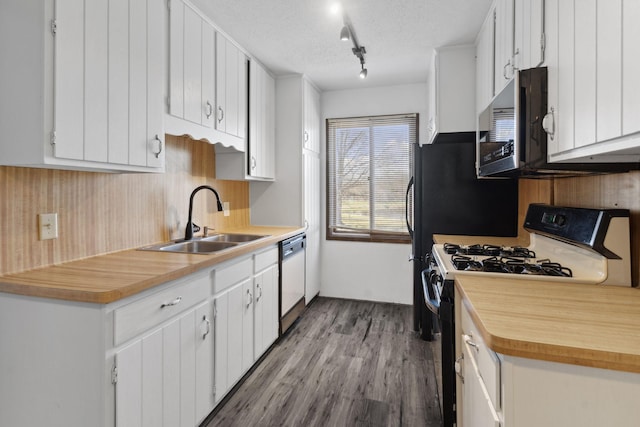 10720 Rockford Rd Unit 215, Plymouth, MN 55442 - kitchen featuring range with gas cooktop, stainless steel microwave, dishwasher, light countertops, and wood finished floors