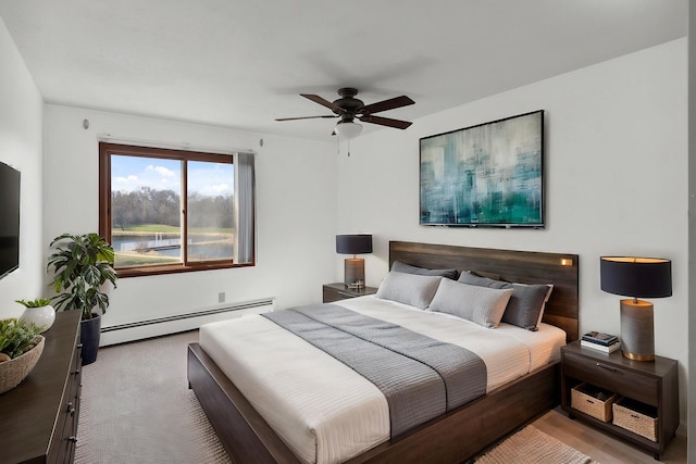 10720 Rockford Rd Unit 215, Plymouth, MN 55442 - bedroom featuring a baseboard radiator and ceiling fan