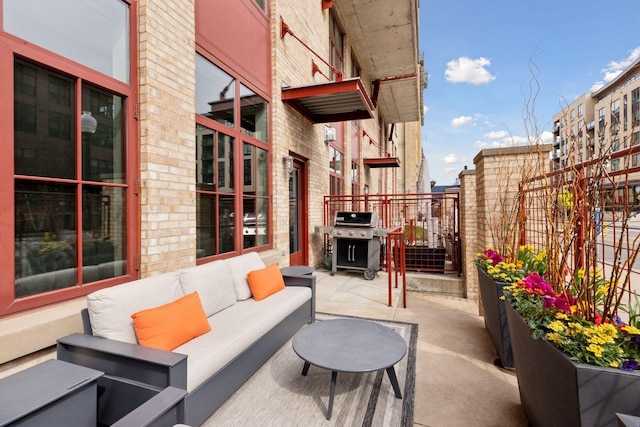 view of patio with area for grilling and outdoor lounge area