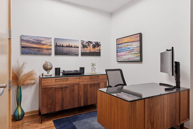 office with wood finished floors and baseboards