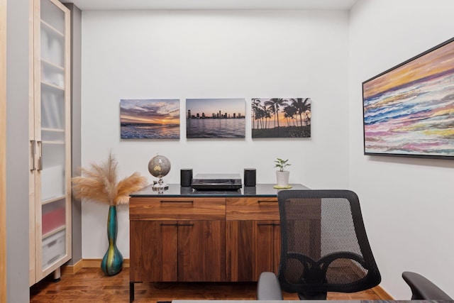 office space featuring wood finished floors and baseboards