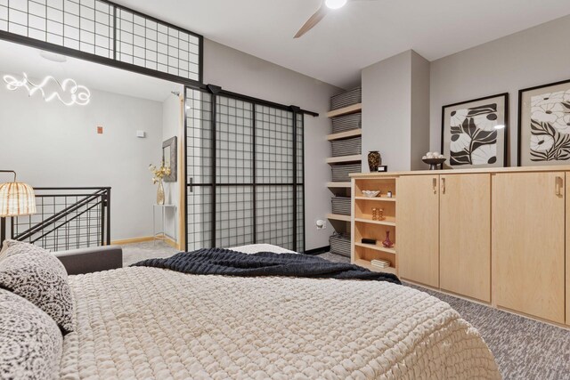 carpeted bedroom with baseboards and ceiling fan