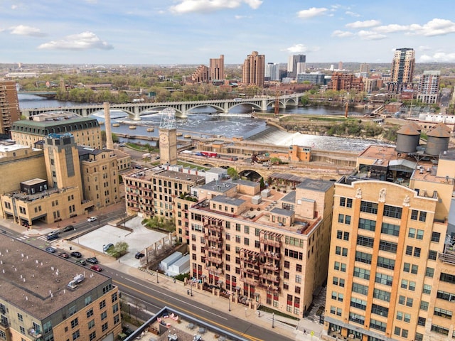 view of urban area featuring a notable bridge and a large body of water