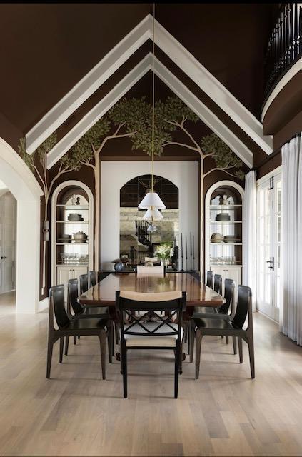 dining room featuring light wood-style flooring, built in shelves, and high vaulted ceiling