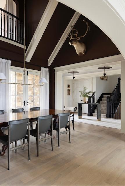 dining area featuring french doors, stairway, beam ceiling, and wood finished floors