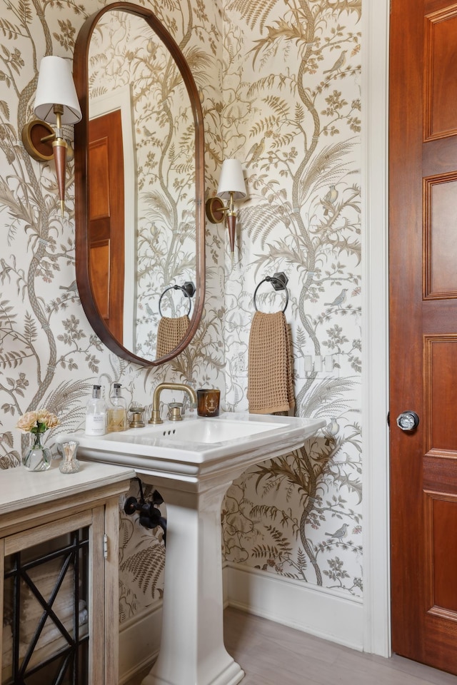 bathroom with wallpapered walls