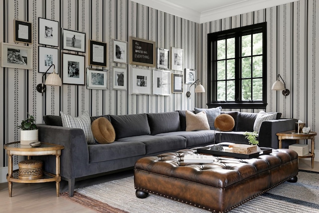 living room featuring wallpapered walls, crown molding, and wood finished floors