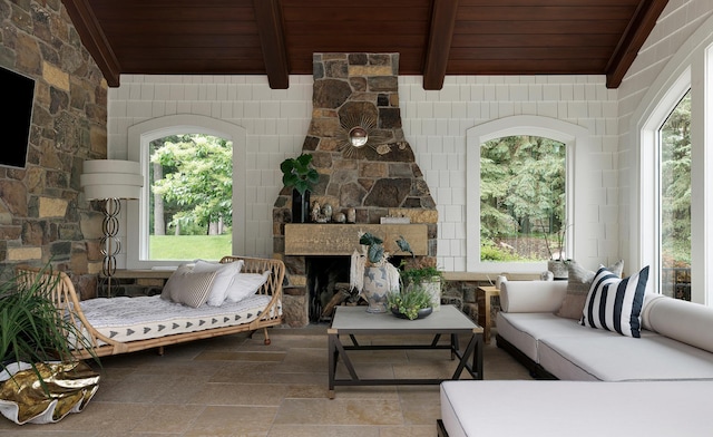 view of patio featuring an outdoor living space with a fireplace