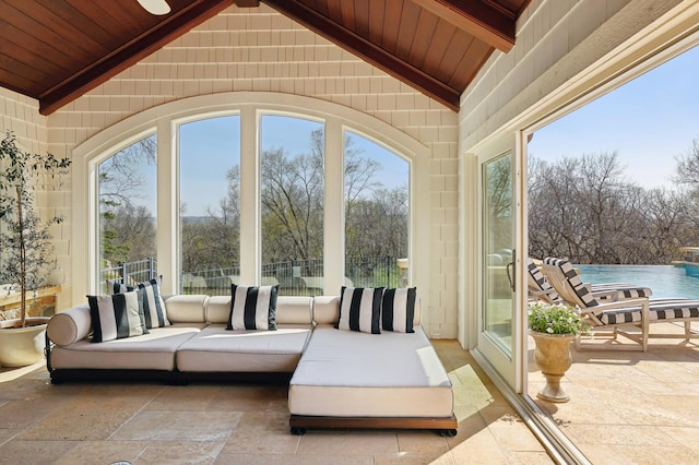 sunroom with beam ceiling