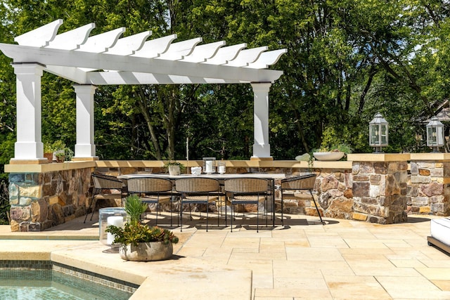 view of patio / terrace with a pergola and outdoor dining area