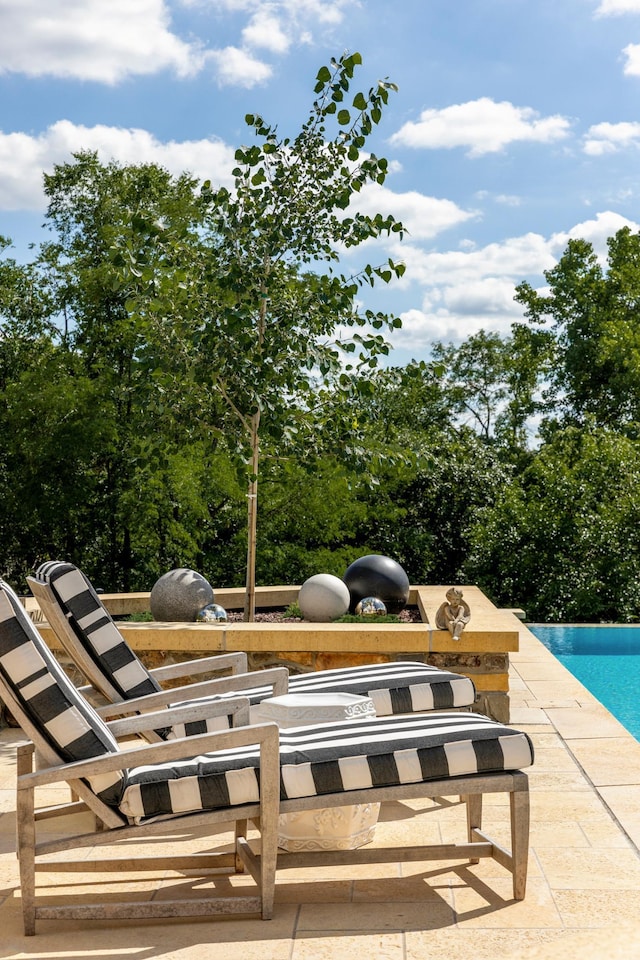 exterior space with an outdoor pool
