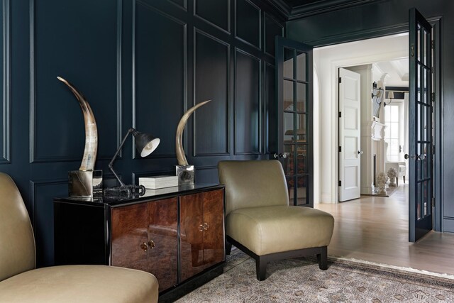 sitting room with a decorative wall