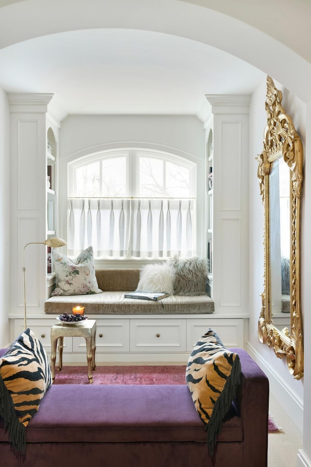 sitting room featuring carpet flooring and lofted ceiling