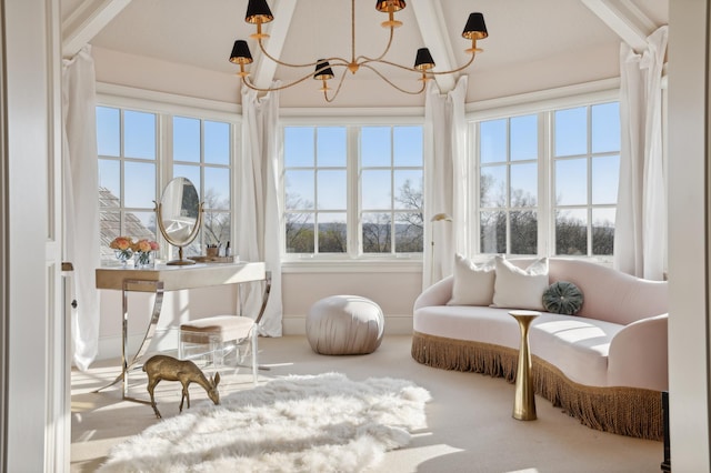 sunroom / solarium with a notable chandelier