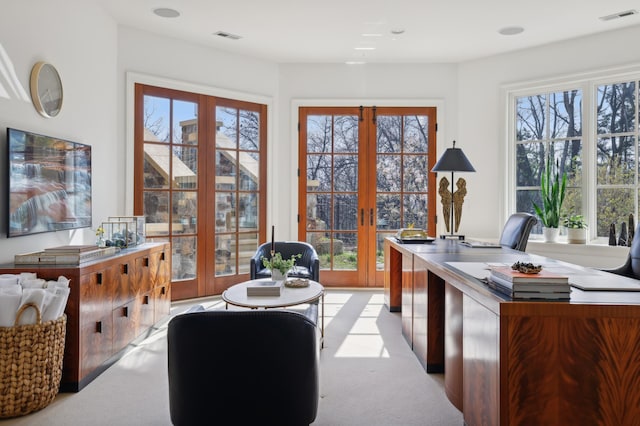 home office featuring french doors, visible vents, and a healthy amount of sunlight