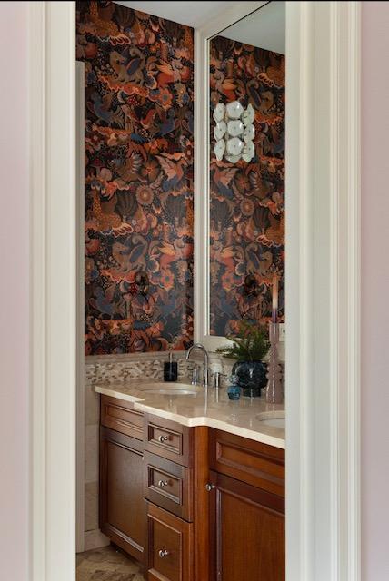 bar with wallpapered walls, wet bar, and a sink