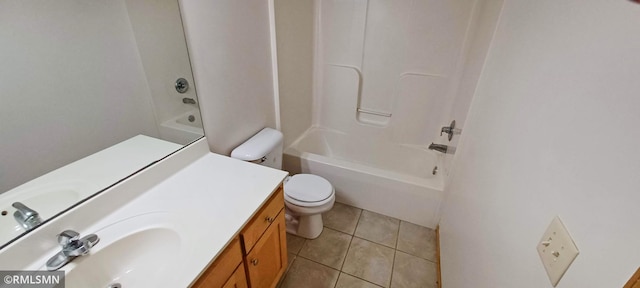 bathroom with toilet, vanity, tile patterned flooring, and shower / washtub combination