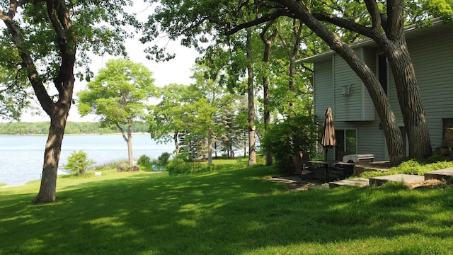 26837 Lake Ethel Rd, Girard Twp, MN 56515 - view of green lawn featuring a water view
