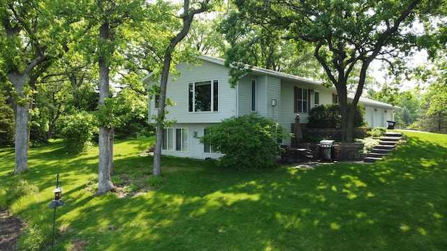 26837 Lake Ethel Rd, Girard Twp, MN 56515 - back of house with a yard and an attached garage