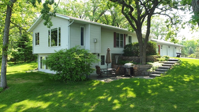 26837 Lake Ethel Rd, Girard Twp, MN 56515 - back of house featuring a yard, stairs, a patio area, and an attached garage