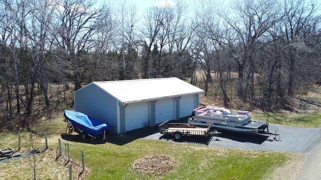 26837 Lake Ethel Rd, Girard Twp, MN 56515 - detached garage featuring a wooded view