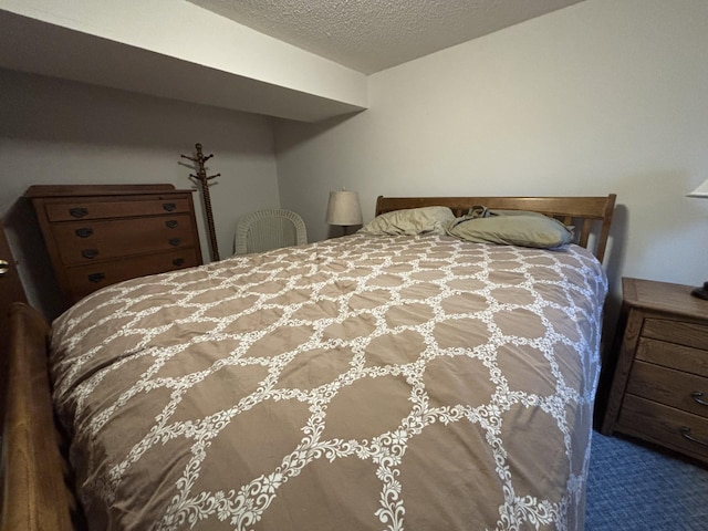 26837 Lake Ethel Rd, Girard Twp, MN 56515 - bedroom with a textured ceiling and carpet floors