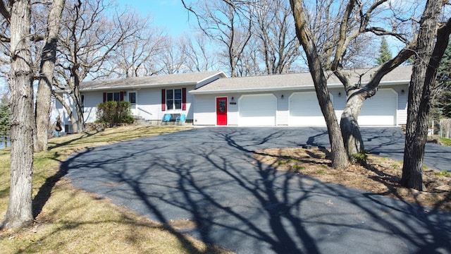 26837 Lake Ethel Rd, Girard Twp, MN 56515 - ranch-style house with asphalt driveway, a garage, a front lawn, and roof with shingles