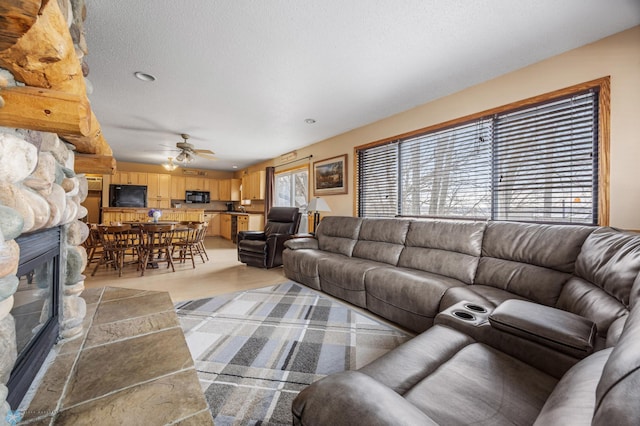 15924 Blackhawk Rd, Lake Park, MN 56554 - living room with a ceiling fan, a stone fireplace, and light wood finished floors