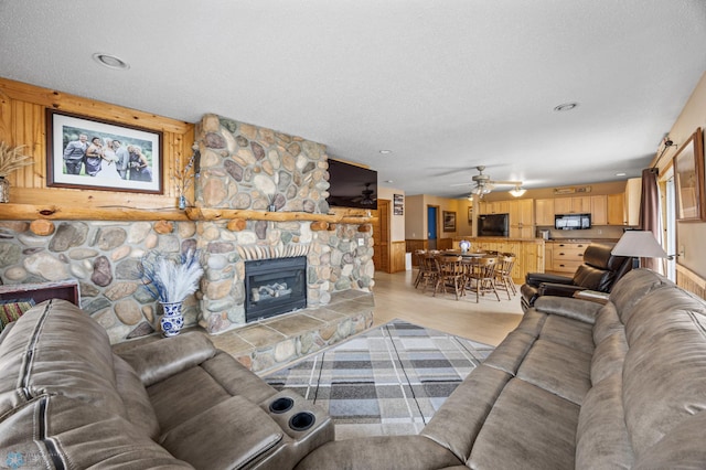 15924 Blackhawk Rd, Lake Park, MN 56554 - living room with light wood-style flooring, a fireplace, ceiling fan, a textured ceiling, and recessed lighting