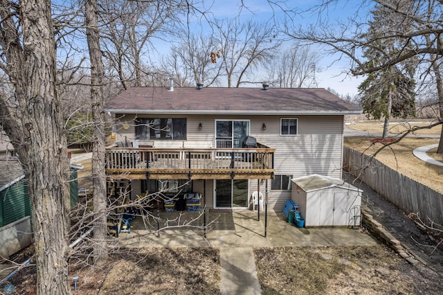 15924 Blackhawk Rd, Lake Park, MN 56554 - back of property featuring a wooden deck, a patio area, a fenced backyard, and a shingled roof