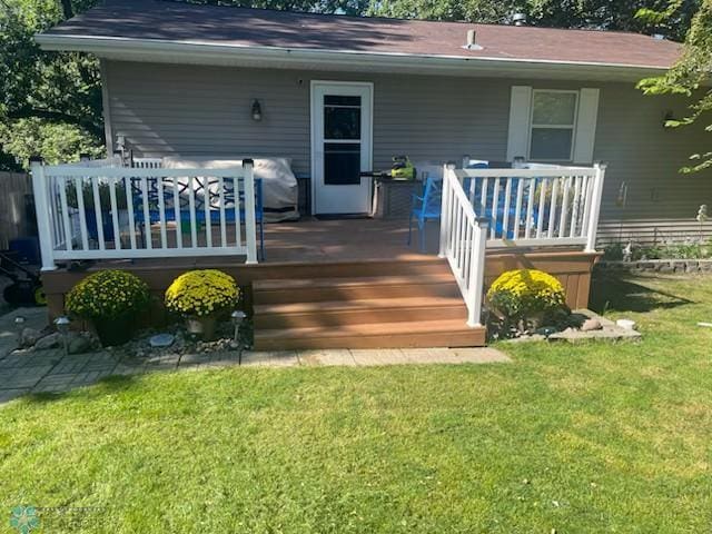 15924 Blackhawk Rd, Lake Park, MN 56554 - back of house featuring a yard and a wooden deck