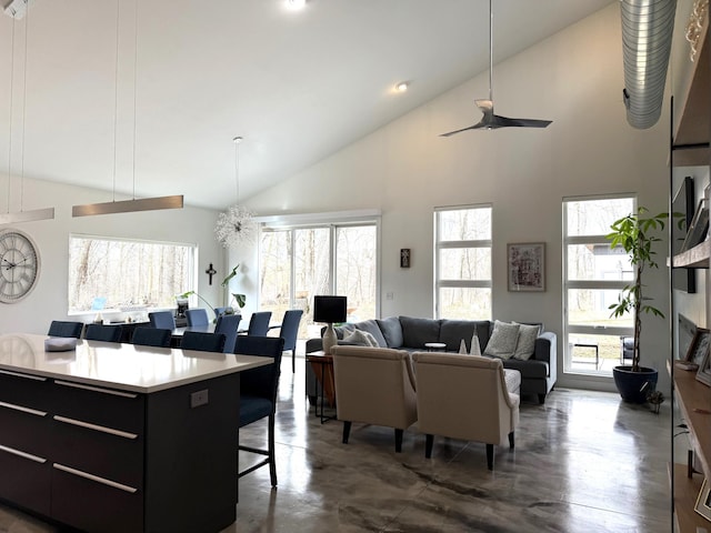 4405 17th Ave NW, Sauk Rapids, MN 56379 - living room with high vaulted ceiling, ceiling fan, and finished concrete floors