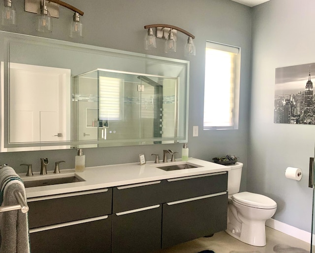 4405 17th Ave NW, Sauk Rapids, MN 56379 - full bathroom with a sink, toilet, double vanity, and a stall shower