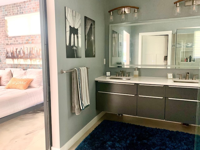 4405 17th Ave NW, Sauk Rapids, MN 56379 - ensuite bathroom with double vanity, a sink, baseboards, and ensuite bath