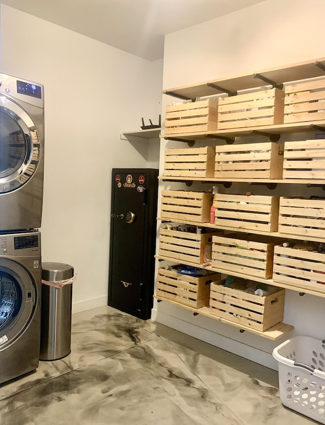 4405 17th Ave NW, Sauk Rapids, MN 56379 - laundry room with stacked washer / drying machine, baseboards, and laundry area