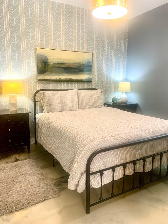 4405 17th Ave NW, Sauk Rapids, MN 56379 - bedroom with wallpapered walls and concrete floors