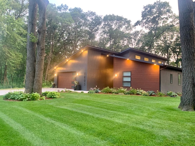 4405 17th Ave NW, Sauk Rapids, MN 56379 - view of front facade featuring a front lawn, driveway, and a garage