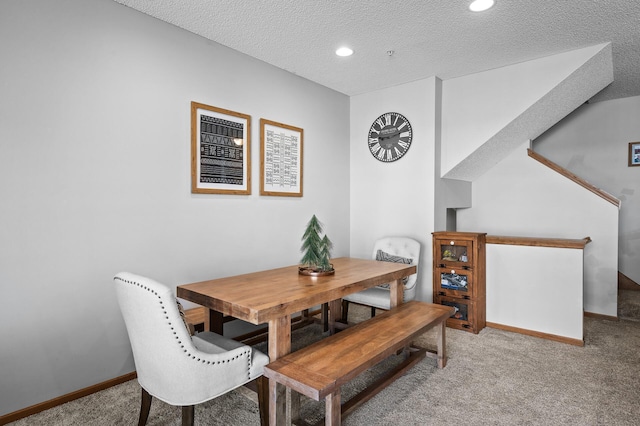 dining room featuring baseboards, carpet flooring, a textured ceiling, and recessed lighting