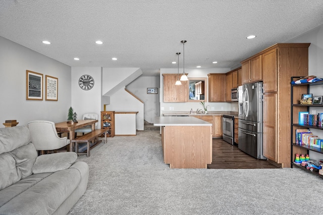 kitchen with open floor plan, dark colored carpet, recessed lighting, and stainless steel appliances