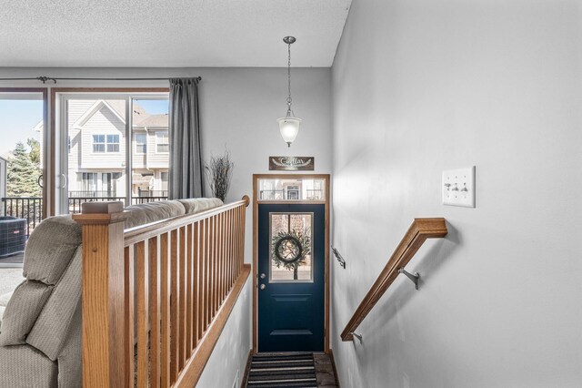 interior space featuring baseboards and a textured ceiling