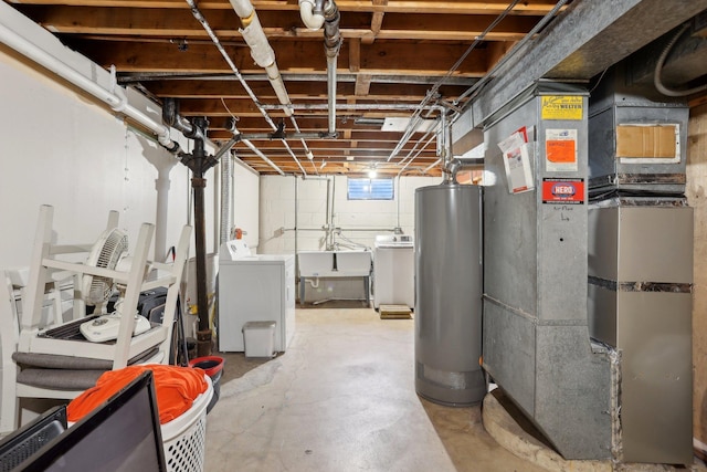 11749 Crooked Lake Blvd NW, Coon Rapids, MN 55433 - below grade area featuring washing machine and dryer, heating unit, water heater, and a sink