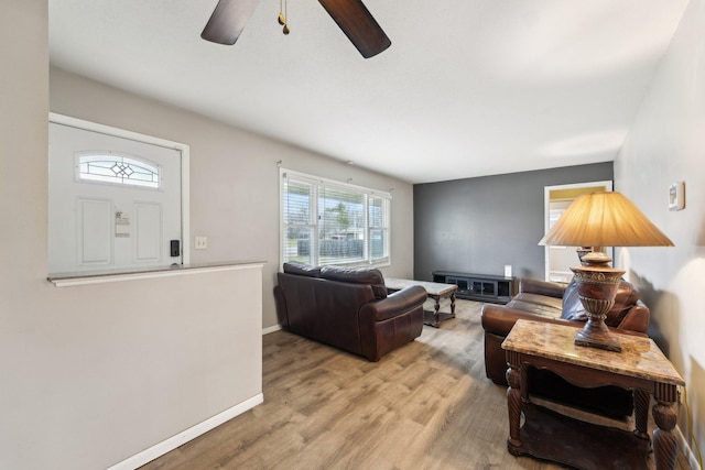 11749 Crooked Lake Blvd NW, Coon Rapids, MN 55433 - living area with baseboards, a ceiling fan, and light wood-style floors
