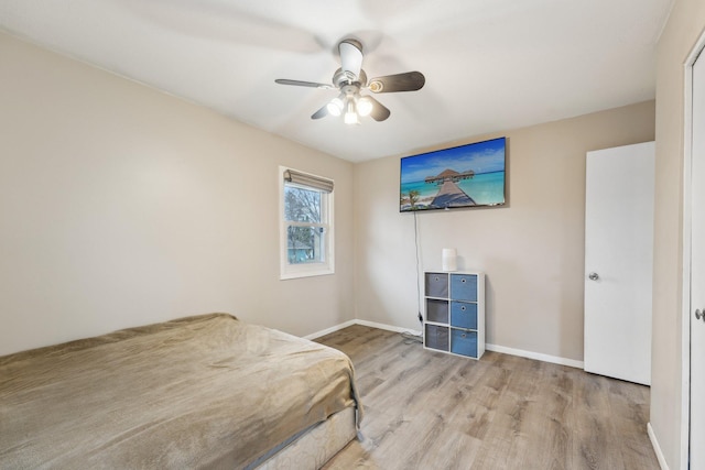 11749 Crooked Lake Blvd NW, Coon Rapids, MN 55433 - bedroom with baseboards, wood finished floors, and a ceiling fan