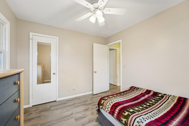 11749 Crooked Lake Blvd NW, Coon Rapids, MN 55433 - bedroom with baseboards, ceiling fan, and light wood finished floors