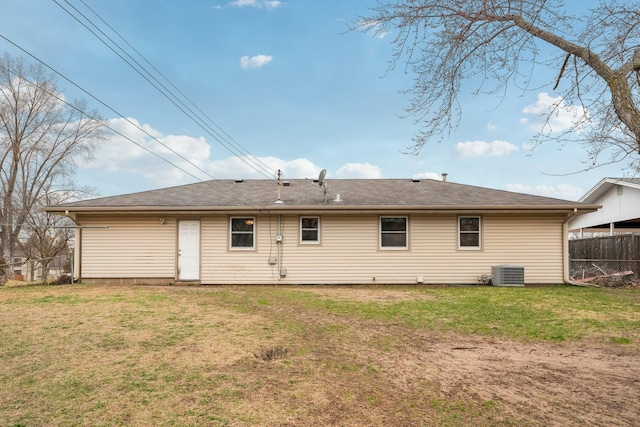 11749 Crooked Lake Blvd NW, Coon Rapids, MN 55433 - back of property featuring fence, cooling unit, and a lawn